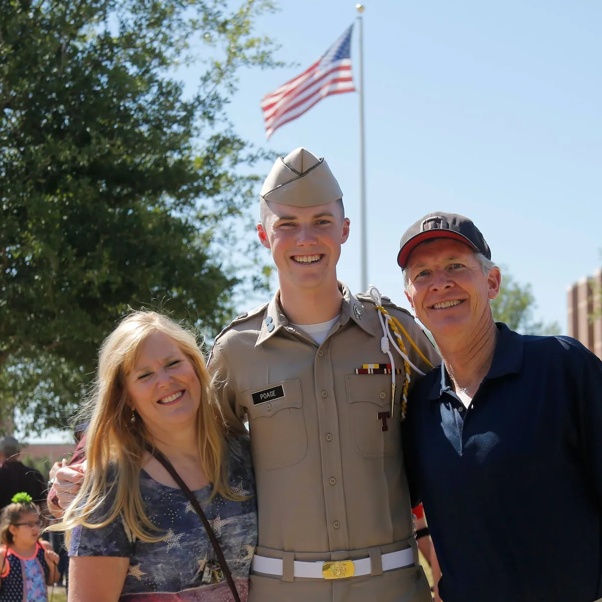 Parker Poage with his parents at Texas A&M while wearing his Corps of Cadets uniform.